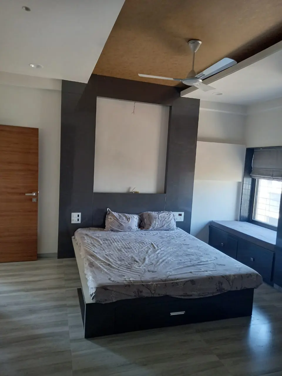 a bed with a white mattress on it showing best interior design pune