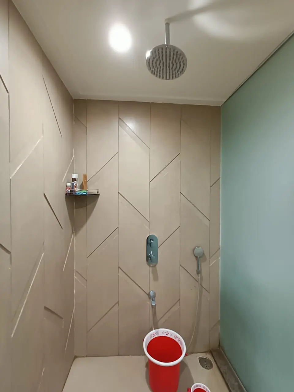 a bathroom with a shower showing best interior desgn pune